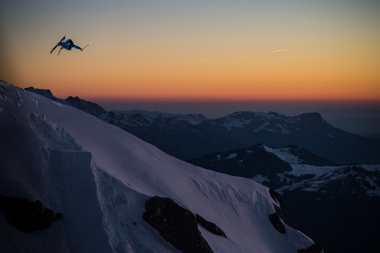 Skier airborne at sunset